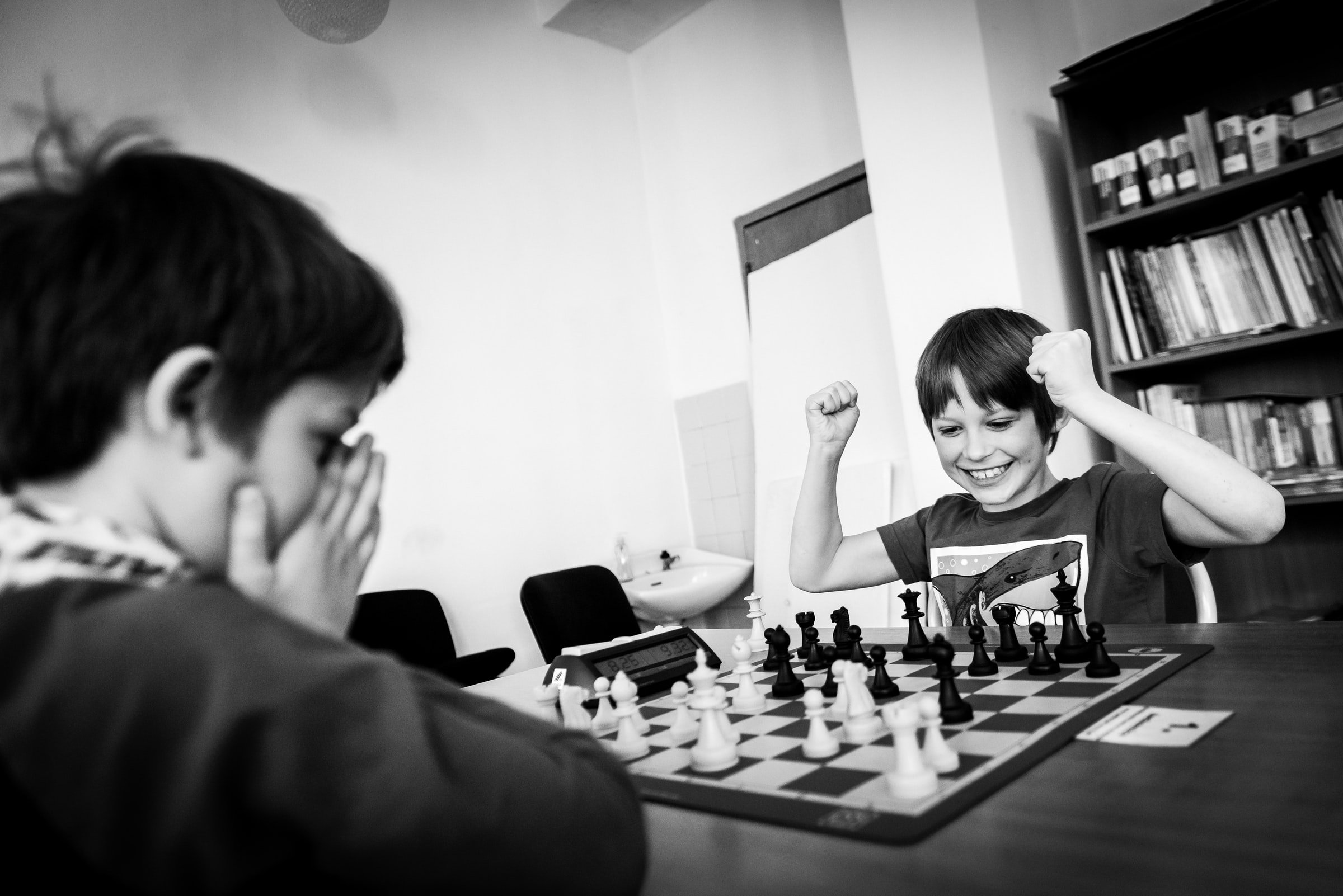Student enjoying playing chess as they win